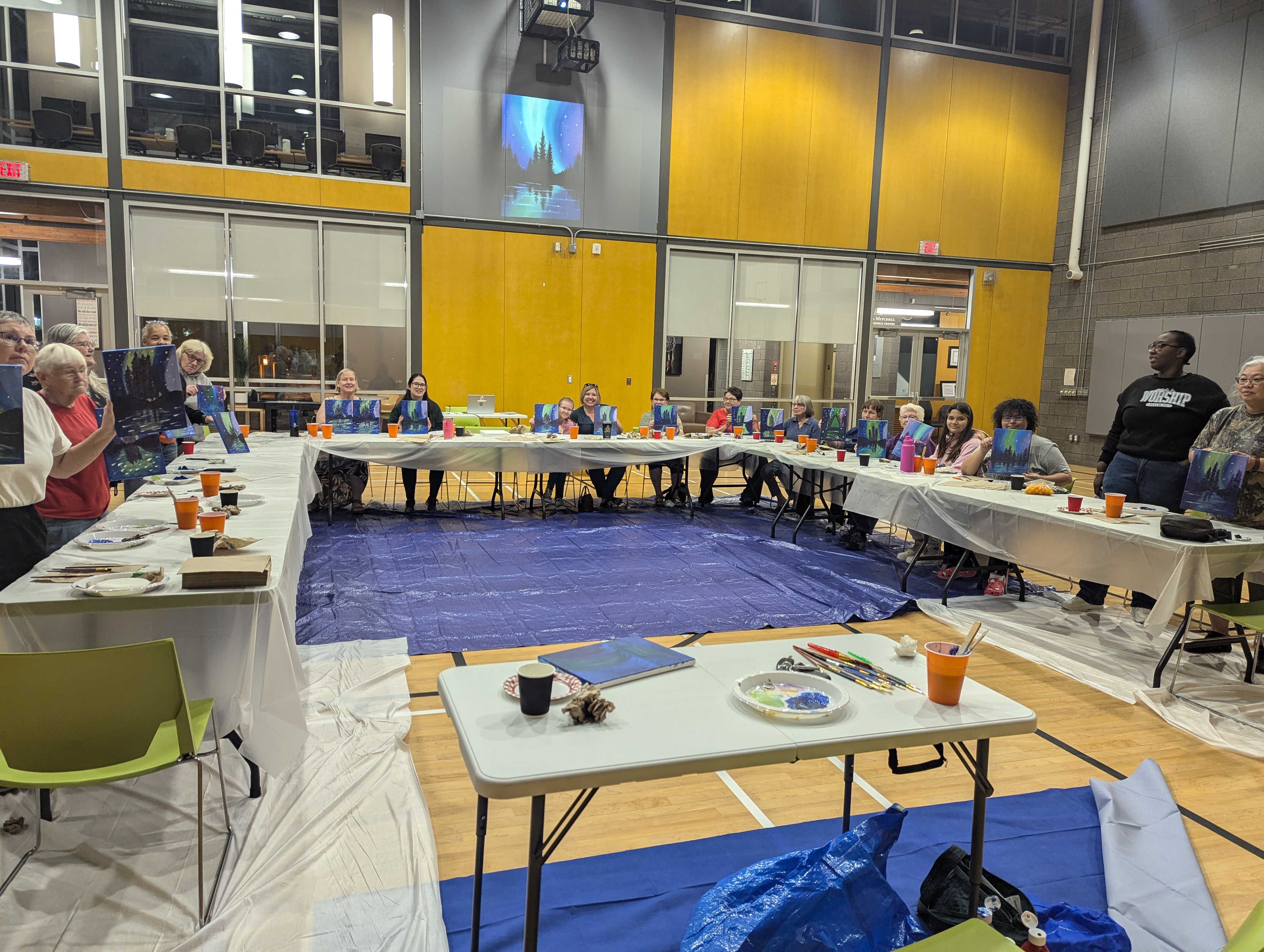 Group of Ladies participating in a Sip and Paint activity during the LHCC Ladies Night Program